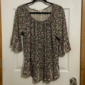 Small flower, mid elbow length top.